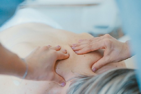 trigger point massage on a person's back